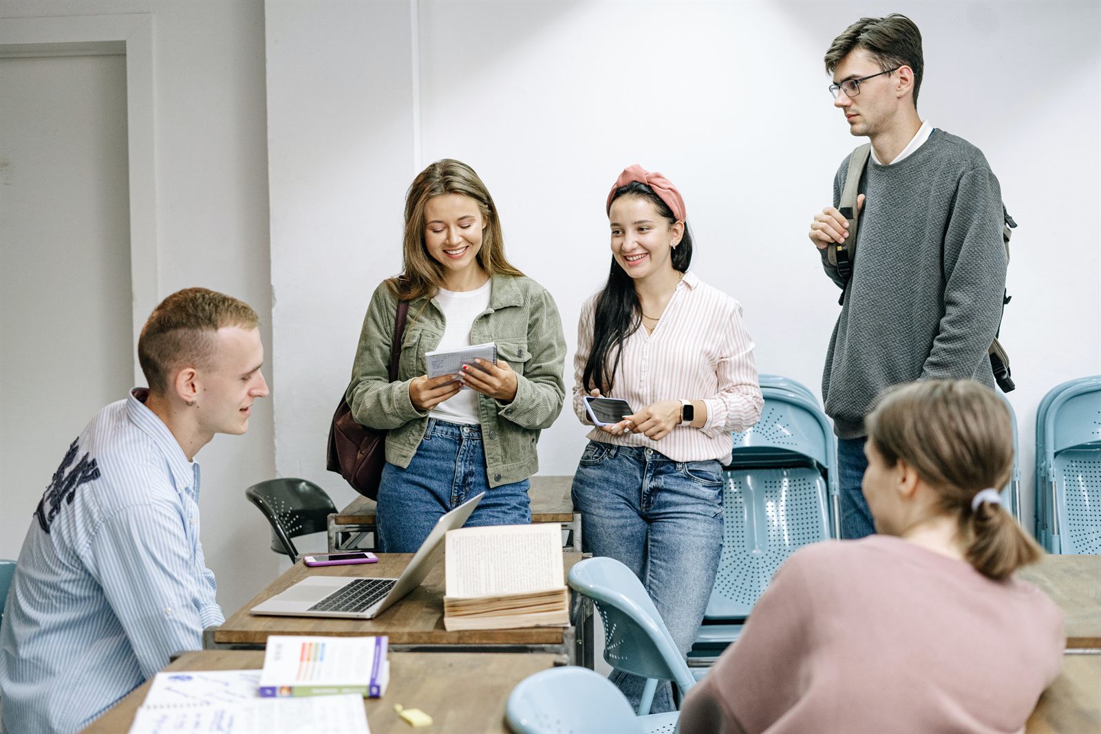 A research team meets around a table.